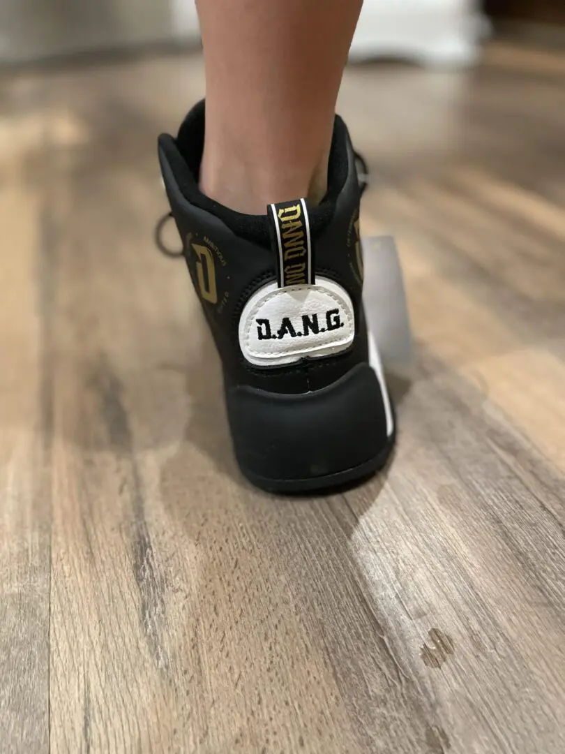 back side of the D.A.N.G. Apparel gold shoes